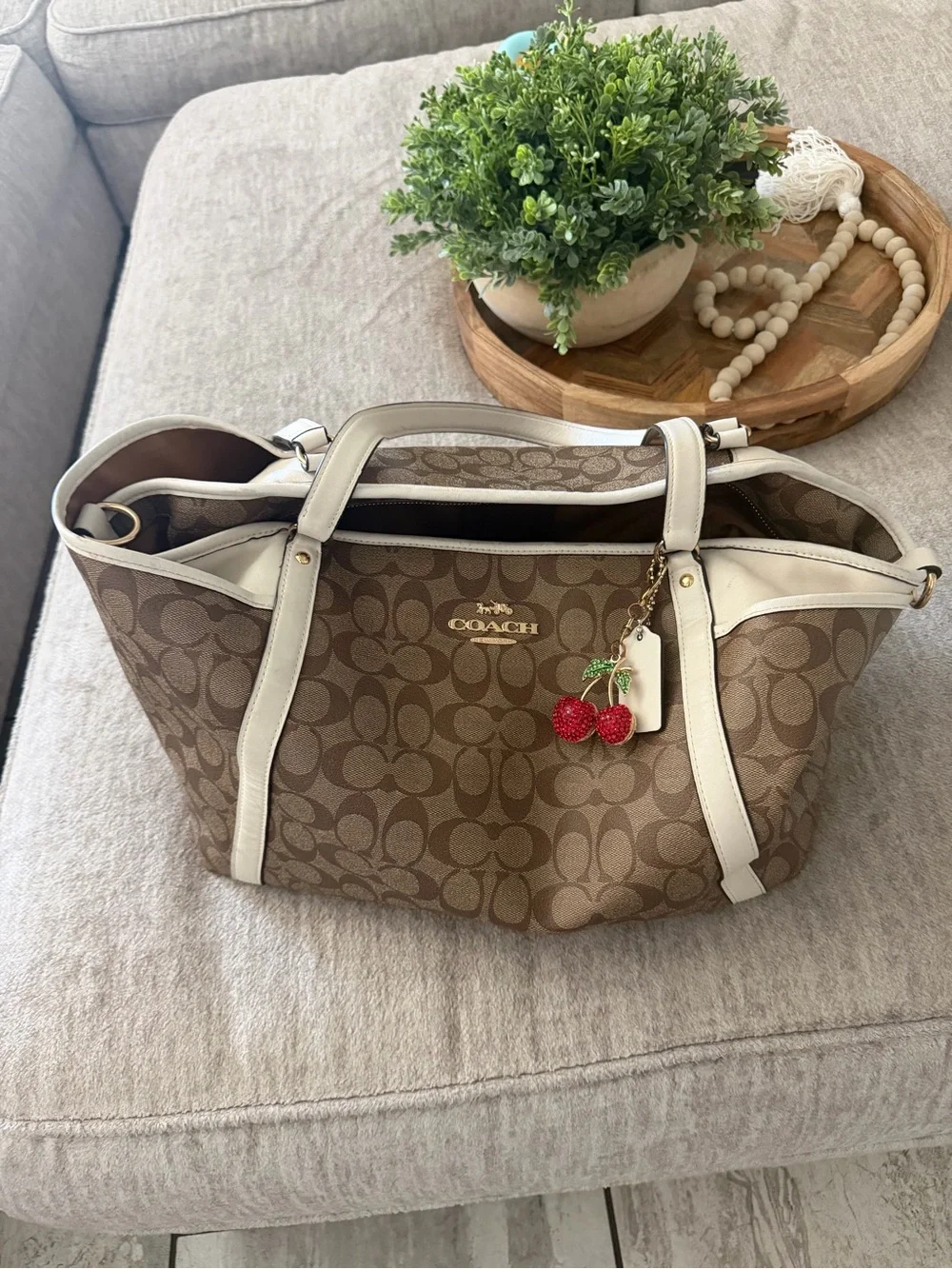 Coach Tan Signature Canvas Baby Bag with White Trim and Cherry Charm
